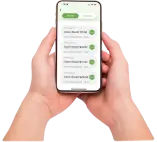 Close-up of a user's hand holding a smartphone with a list of available topups of different amounts